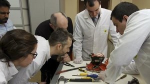 Aviation experts inspect the flight recorder from the crashed Boeing 737-800 Flight FZ981 operated by Dubai-based budget carrier Flydubai, in Moscow, Russia, in this handout image released by the Russia's Interstate Aviation Committee on March 20, 2016. REUTERS/Interstate Aviation Committee/Handout via Reuters  ATTENTION EDITORS - THIS PICTURE WAS PROVIDED BY A THIRD PARTY. REUTERS IS UNABLE TO INDEPENDENTLY VERIFY THE AUTHENTICITY, CONTENT, LOCATION OR DATE OF THIS IMAGE.