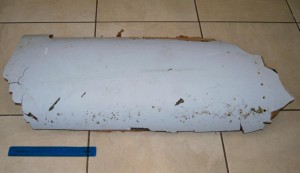 A piece of debris bearing identification marks which may be part of the missing Malaysia Airlines Flight MH370, in Wartburg, 37km (22 miles) out of Pietermaritzburg, South Africa, Wednesday, March 9, 2016.  South African teenager Liam Lotter vacationing with his family in Mozambique on Dec. 30, may have found part of a wing from the missing plane, while he was strolling on the beach. Liam struggled to lift the debris from the beach and carried it back home to South Africa before discovering it might be from the lost plane, but now aviation experts plan to examine the plane fragment. The Malaysia Airlines Boeing 777 jet vanished with 239 people on board while flying from Kuala Lumpur to Beijing on March 8, 2014. (Candace Lotter via AP)