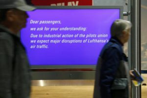 Passengers walk past an information display during a pilots strike of German airline Lufthansa at Frankfurt airport, Germany, November 23, 2016. REUTERS/Ralph Orlowski